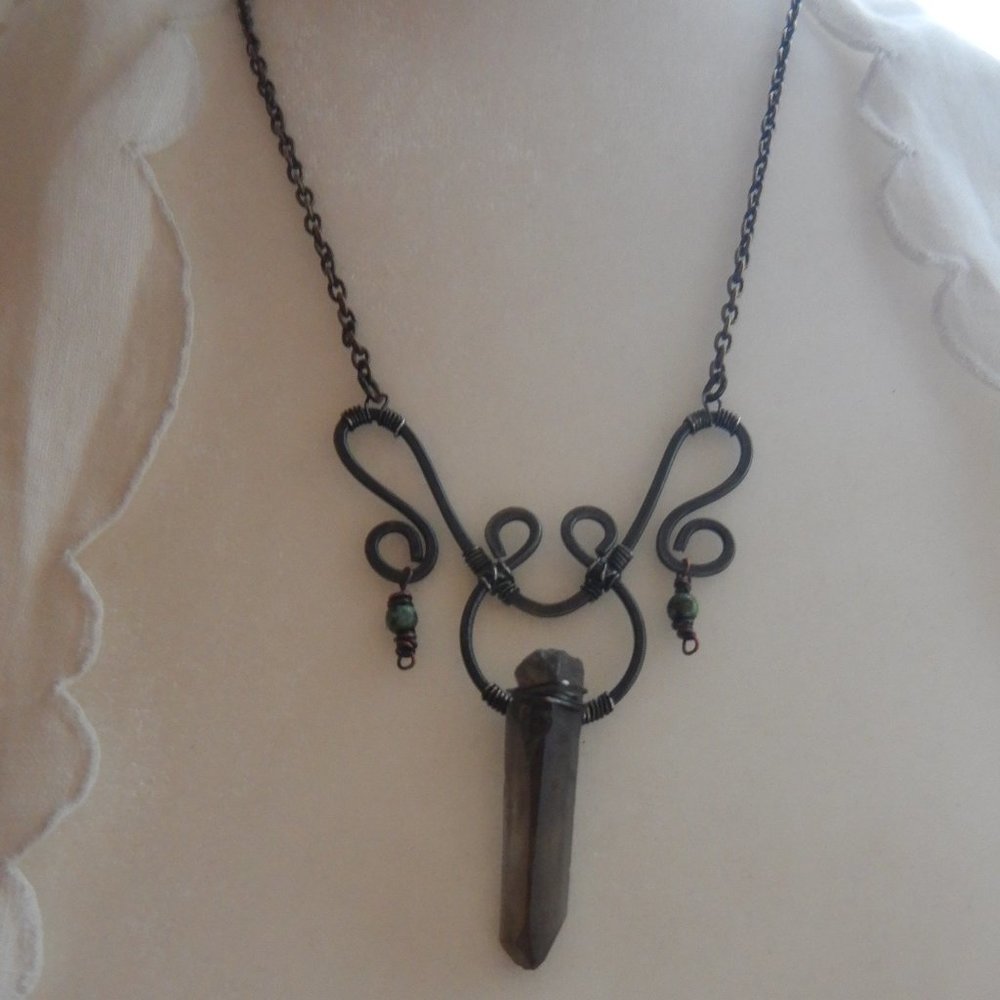 Handcrafted hammered wire necklace, with a smokey quartz crystal